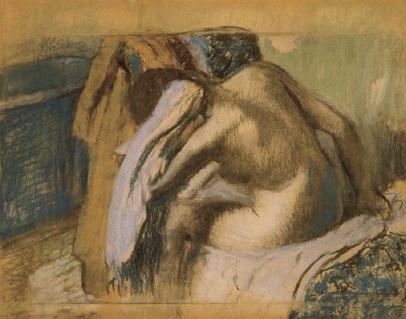  Woman drying her hair after the bath